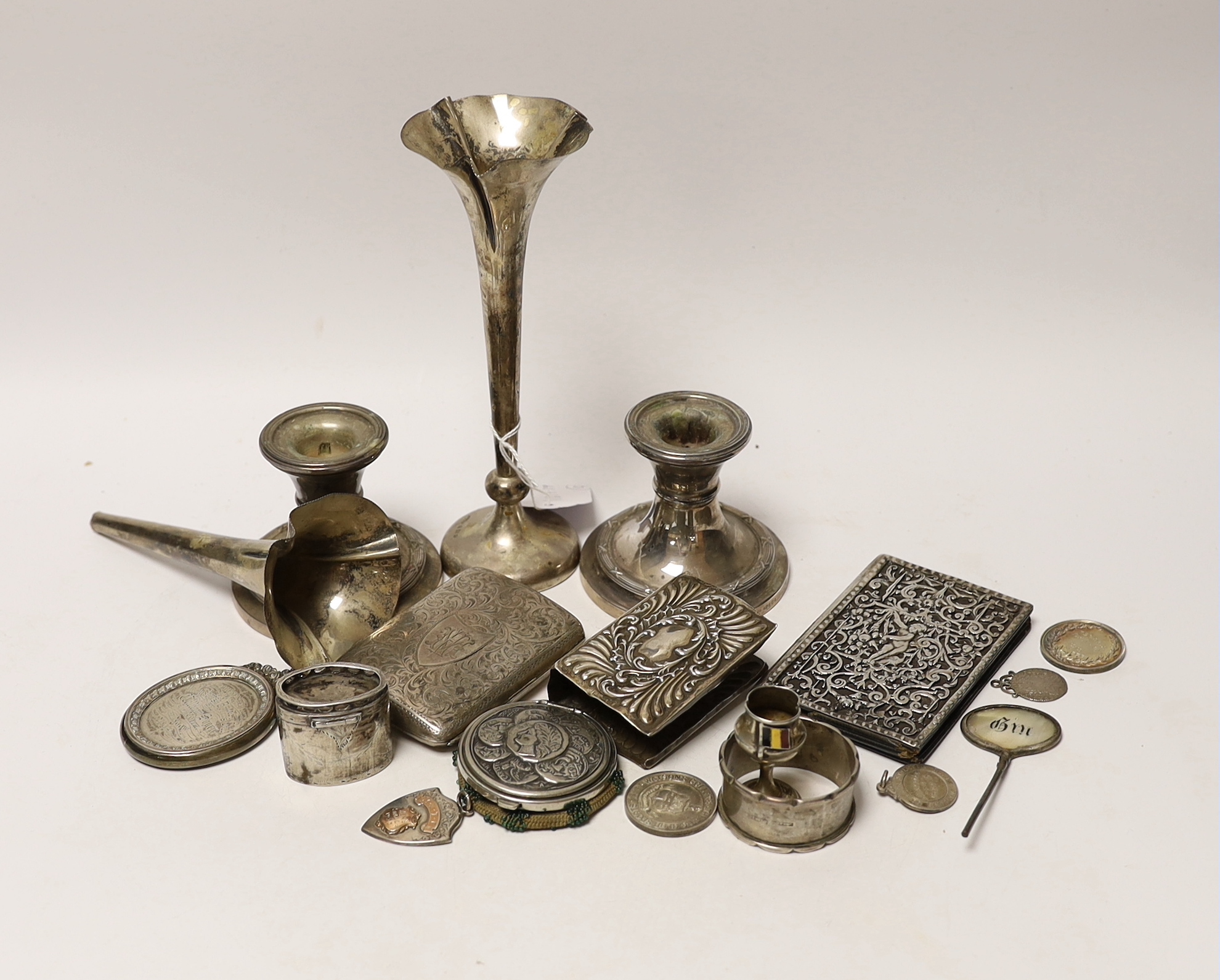 A modern pair of silver mounted dwarf candlesticks and other sundry silver items including cigarette case, medals etc.